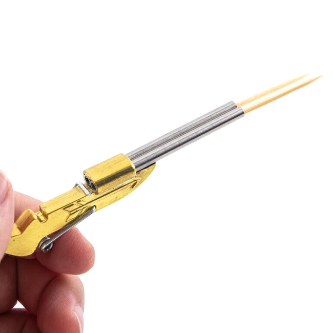 іграшка у вигляді зброї що стріляє зубочистками