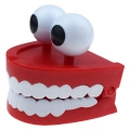 заводная игрушка с зубами и глазами