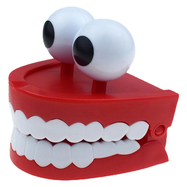заводная игрушка с зубами и глазами