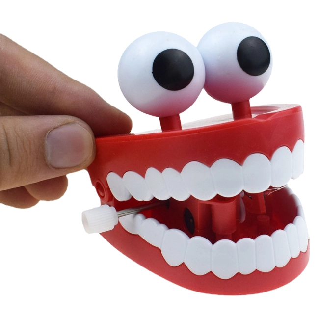 заводная игрушка в форме зубов с глазами
