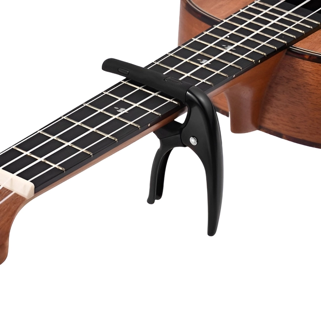 Затискач для струн на гітарі