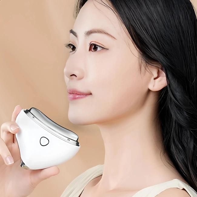 Електричний прилад для масажу обличчя