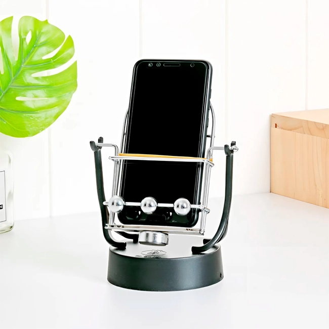 маятник с подставкой для телефона