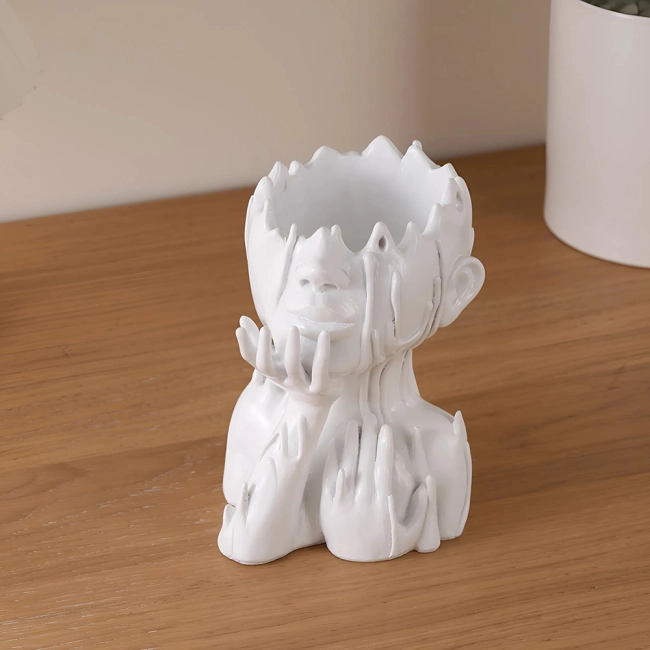 Кашпо у формі голови дівчини