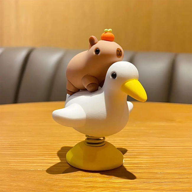 Статуетка з пружиною