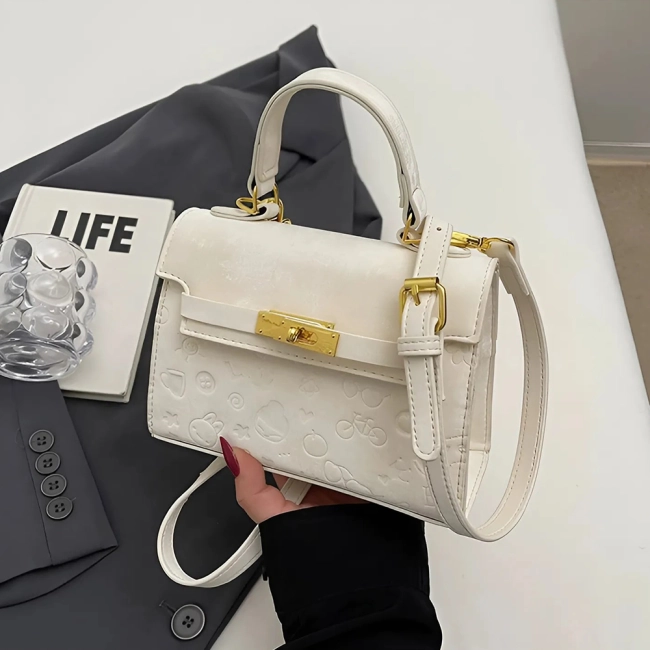 жіноча сумка з тисненням