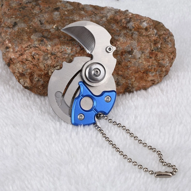 брелок монета зі прихованим ножем