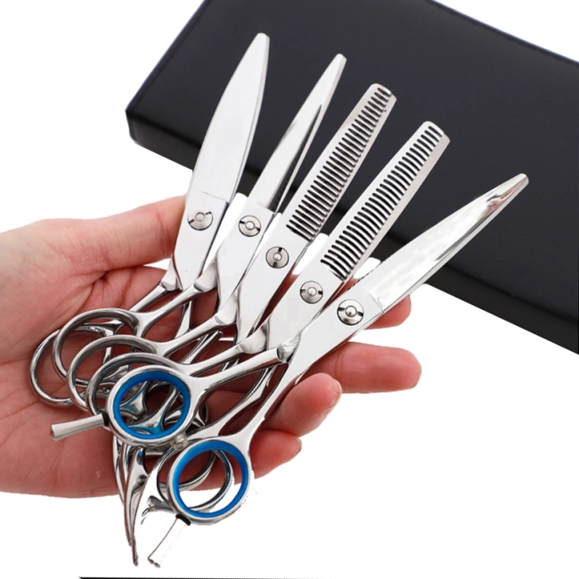набір ножиць перукаря